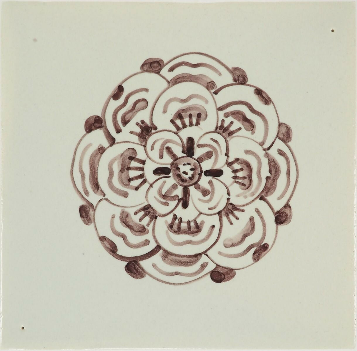 Decorative tile with a brown floral pattern on a light gray background,  available  to buy on the-salon.com. SALON curates the finest , unique, handmade pieces from the interior industry's best makers and brands. Shop luxury furniture, lighting, rugs, art, antiques and vintage pieces and accessories from SALON interior designed rooms.