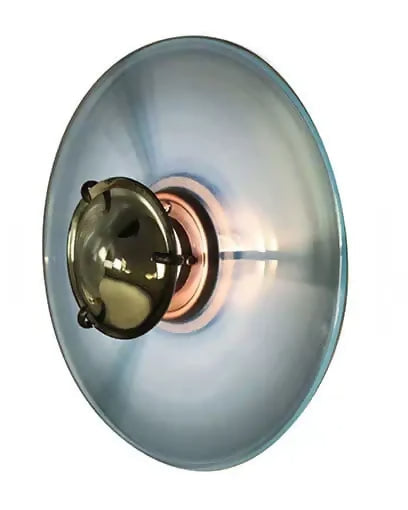 A modern circular wall sconce with a brushed silver metal outer shade and a central brass-toned fixture, shown against a plain white background.