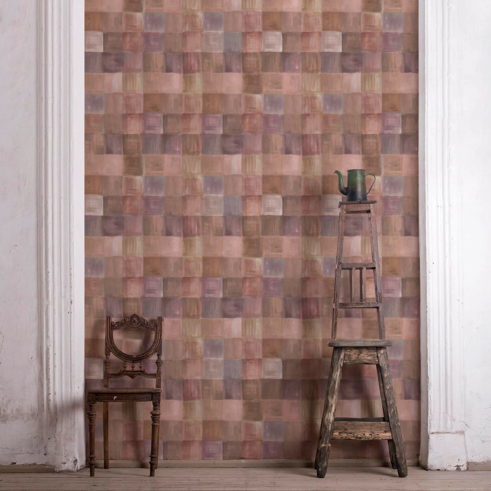 Wall with patchwork pattern, wooden chair, and ladder against a white wall,  available  to buy on the-salon.com. SALON curates the finest , unique, handmade pieces from the interior industry's best makers and brands. Shop luxury furniture, lighting, rugs, art, antiques and vintage pieces and accessories from SALON interior designed rooms.