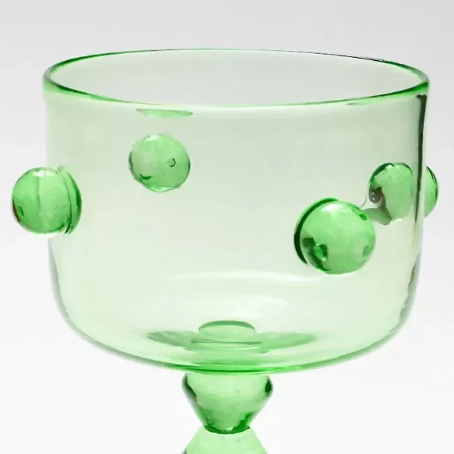Green glass trifle vase with embedded green marbles on a white background, available  to buy on the-salon.com. SALON curates the finest , unique, handmade pieces from the interior industry's best makers and brands. Shop luxury furniture, lighting, rugs, art, antiques and vintage pieces and accessories from SALON interior designed rooms.
