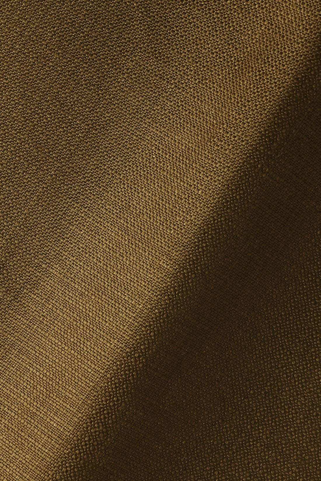 A close up on brown fabric, for the Cavendish armchair,  available  to buy on the-salon.com. SALON curates the finest , unique, handmade pieces from the interior industry's best makers and brands. Shop luxury furniture, lighting, rugs, art, antiques and vintage pieces and accessories from SALON interior designed rooms.