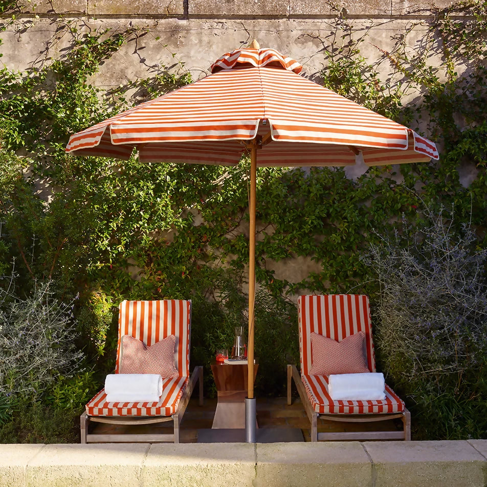 ORANGE AND WHITE STRIPED PARASOL BY PLIA PARASOLS