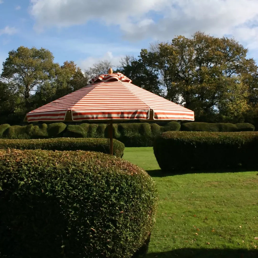 ORANGE AND WHITE STRIPED PARASOL BY PLIA PARASOLS