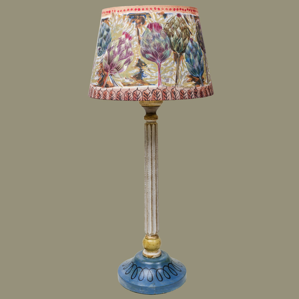 Decorative lamp with a colorful lampshade on a plain background,  available  to buy on the-salon.com. SALON curates the finest , unique, handmade pieces from the interior industry's best makers and brands. Shop luxury furniture, lighting, rugs, art, antiques and vintage pieces and accessories from SALON interior designed rooms.