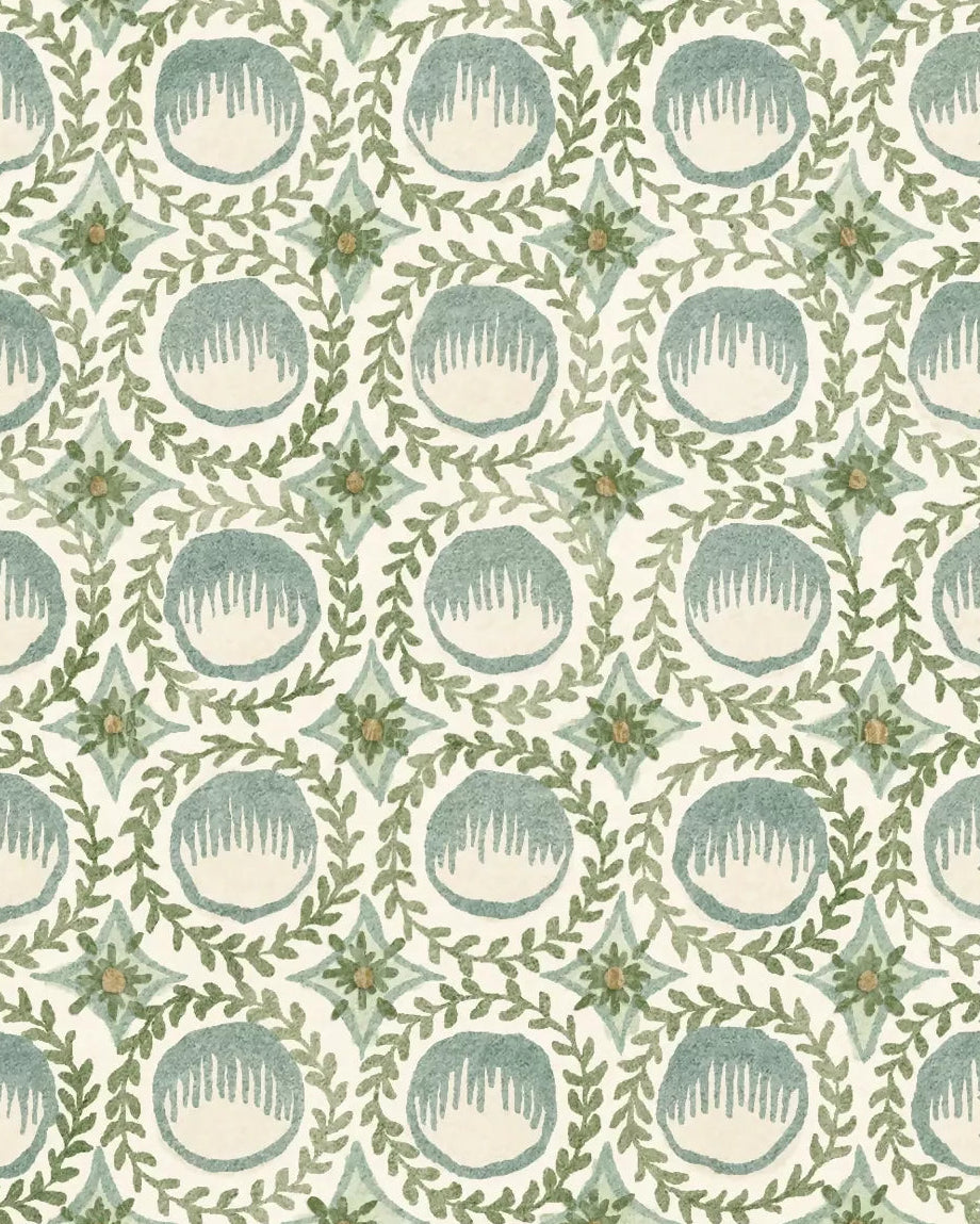 Patterned paper with circular shapes and floral elements on a light background