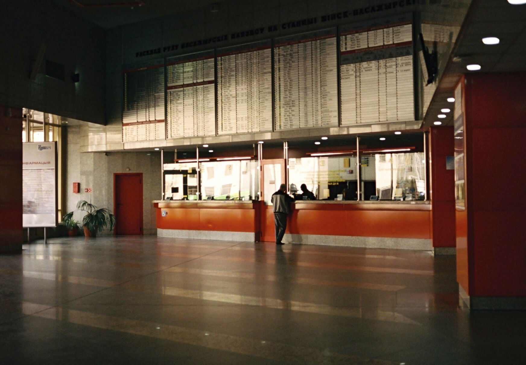 Interior photograph of a train station concourse with a ticket counter, taken during the day with natural and artificial lighting,  available  to buy on the-salon.com. SALON curates the finest , unique, handmade pieces from the interior industry's best makers and brands. Shop luxury furniture, lighting, rugs, art, antiques and vintage pieces and accessories from SALON interior designed rooms.