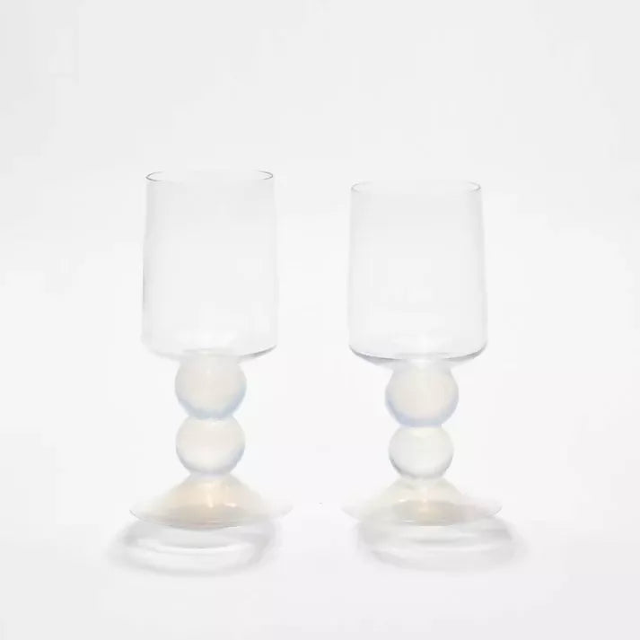 Two clear glasses with spherical bases on a white background,  available  to buy on the-salon.com. SALON curates the finest , unique, handmade pieces from the interior industry's best makers and brands. Shop luxury furniture, lighting, rugs, art, antiques and vintage pieces and accessories from SALON interior designed rooms.