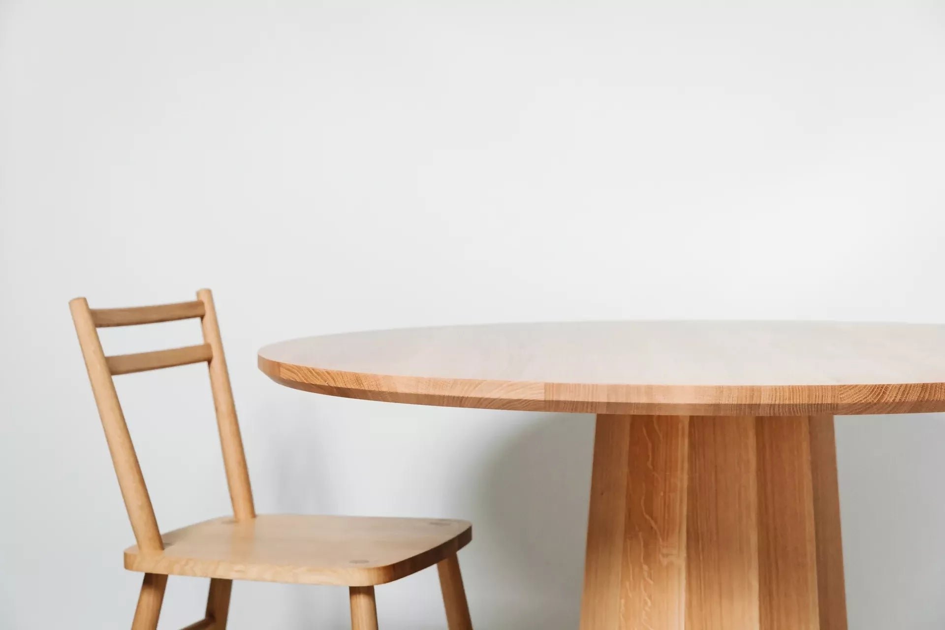 POLYGON PEDESTAL DINING TABLE BY GALVIN BROTHERS