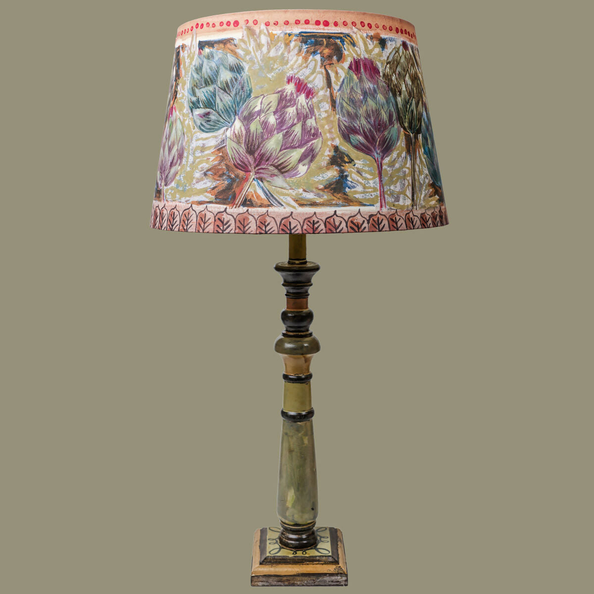 Decorative lamp with a floral-patterned shade on a beige background,  available  to buy on the-salon.com. SALON curates the finest , unique, handmade pieces from the interior industry's best makers and brands. Shop luxury furniture, lighting, rugs, art, antiques and vintage pieces and accessories from SALON interior designed rooms.