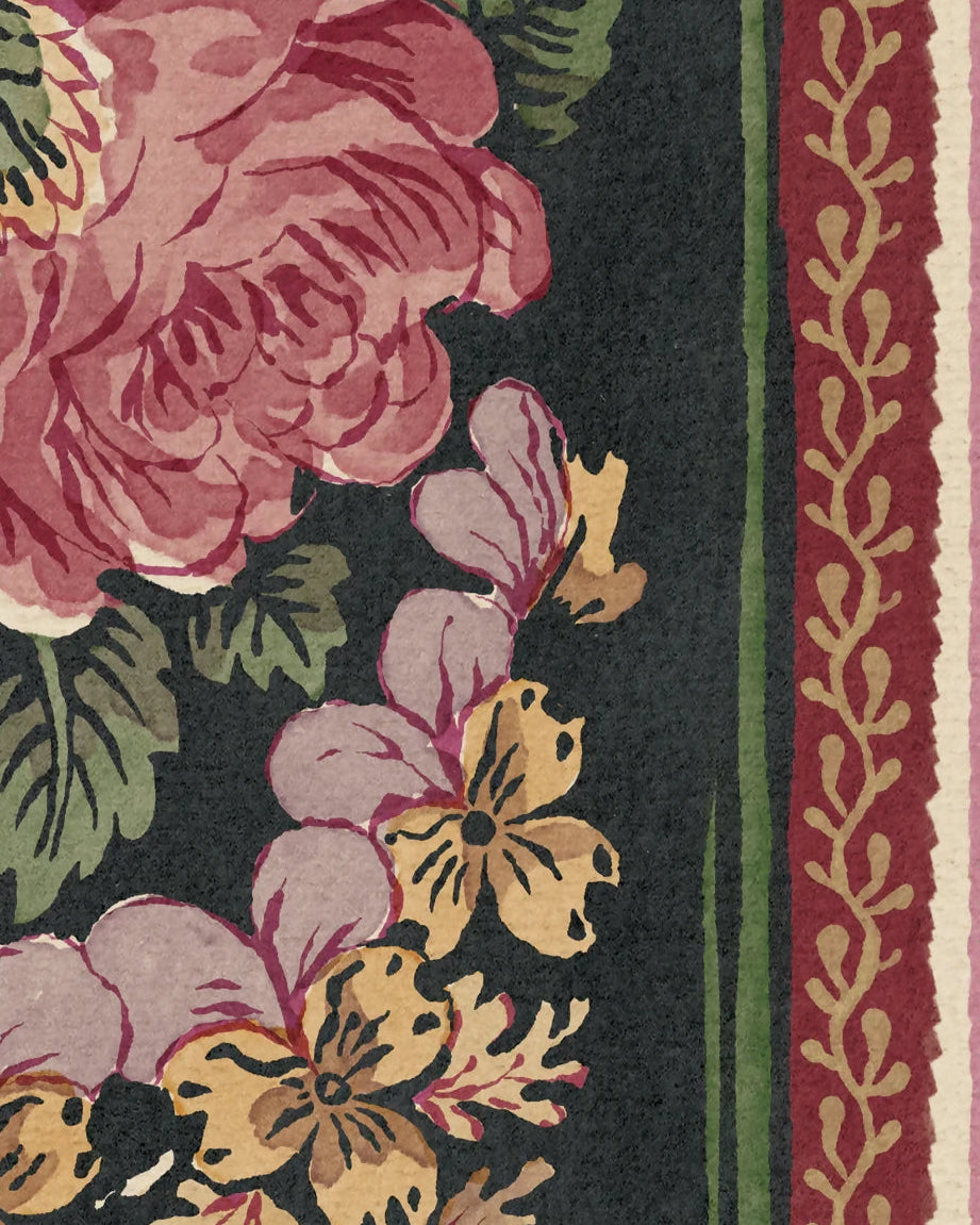 Floral patterned fabric swatch with pink, yellow, and green flowers on a dark background.
