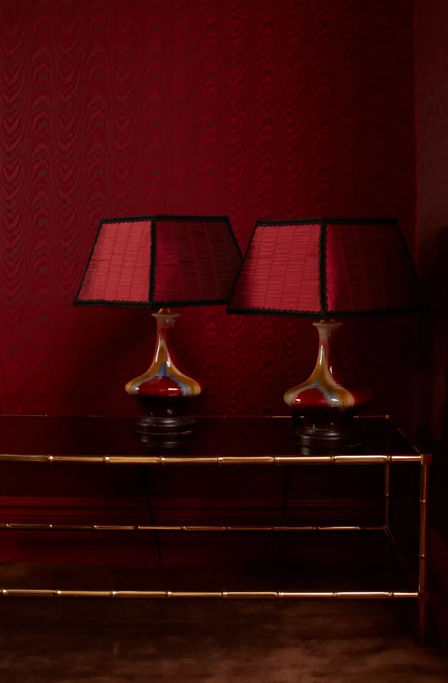 Close-up of a red textured fabric with subtle rouches , as lampshades, woven in the UK,  available  to buy on the-salon.com. SALON curates the finest , unique, handmade pieces from the interior industry's best makers and brands. Shop luxury furniture, lighting, rugs, art, antiques and vintage pieces and accessories from SALON interior designed rooms.