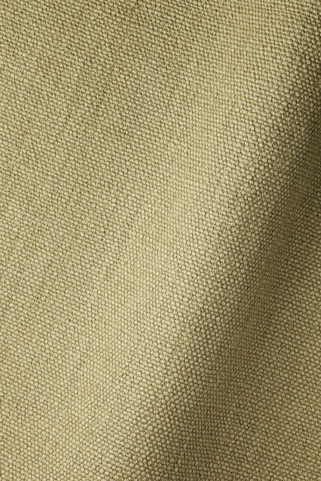 A close up on a neutral heavy linen fabric, for the Cavendish armchair,  available  to buy on the-salon.com. SALON curates the finest , unique, handmade pieces from the interior industry's best makers and brands. Shop luxury furniture, lighting, rugs, art, antiques and vintage pieces and accessories from SALON interior designed rooms.