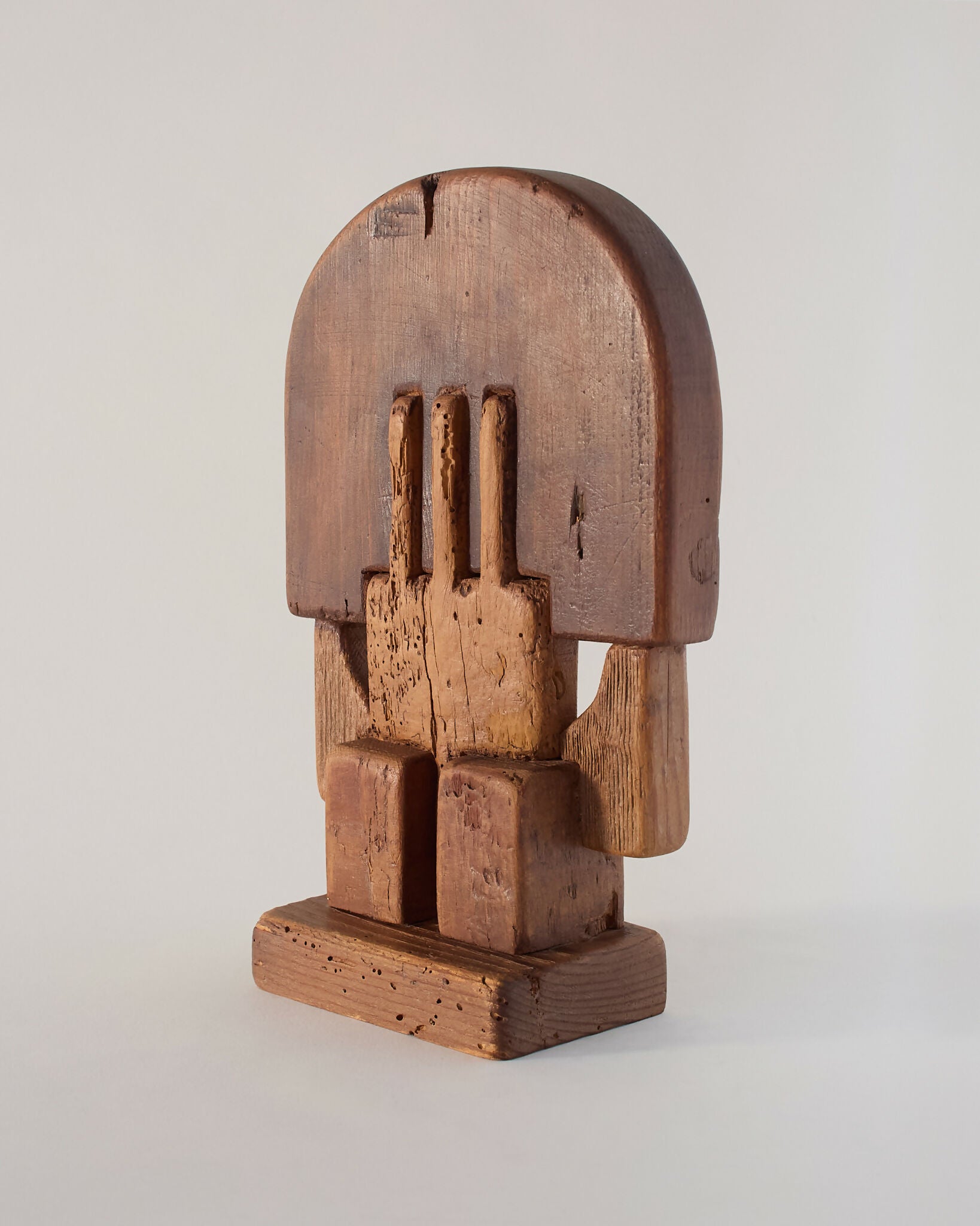 A hand-carved wooden sculpture by Adolf Vallazza, featuring an abstract figure with interlocking forms, with a dark brown to black color, available  to buy on the-salon.com. SALON curates the finest , unique, handmade pieces from the interior industry's best makers and brands. Shop luxury furniture, lighting, rugs, art, antiques and vintage pieces and accessories from SALON interior designed rooms.