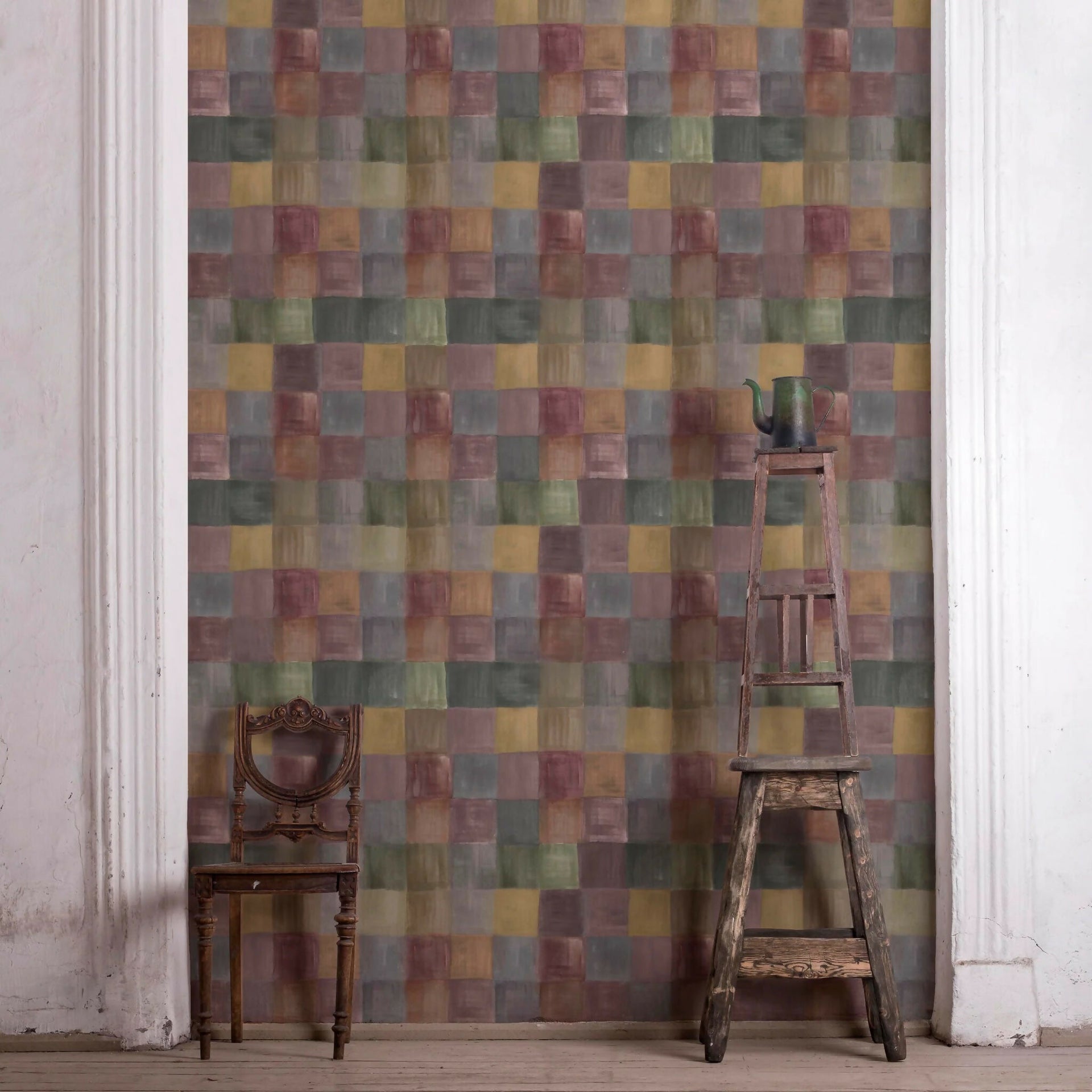 Room with a multicoloured square-patterned wall, wooden chair, and ladder - available  to buy on the-salon.com. SALON curates the finest , unique, handmade pieces from the interior industry's best makers and brands. Shop luxury furniture, lighting, rugs, art, antiques and vintage pieces and accessories from SALON interior designed rooms.