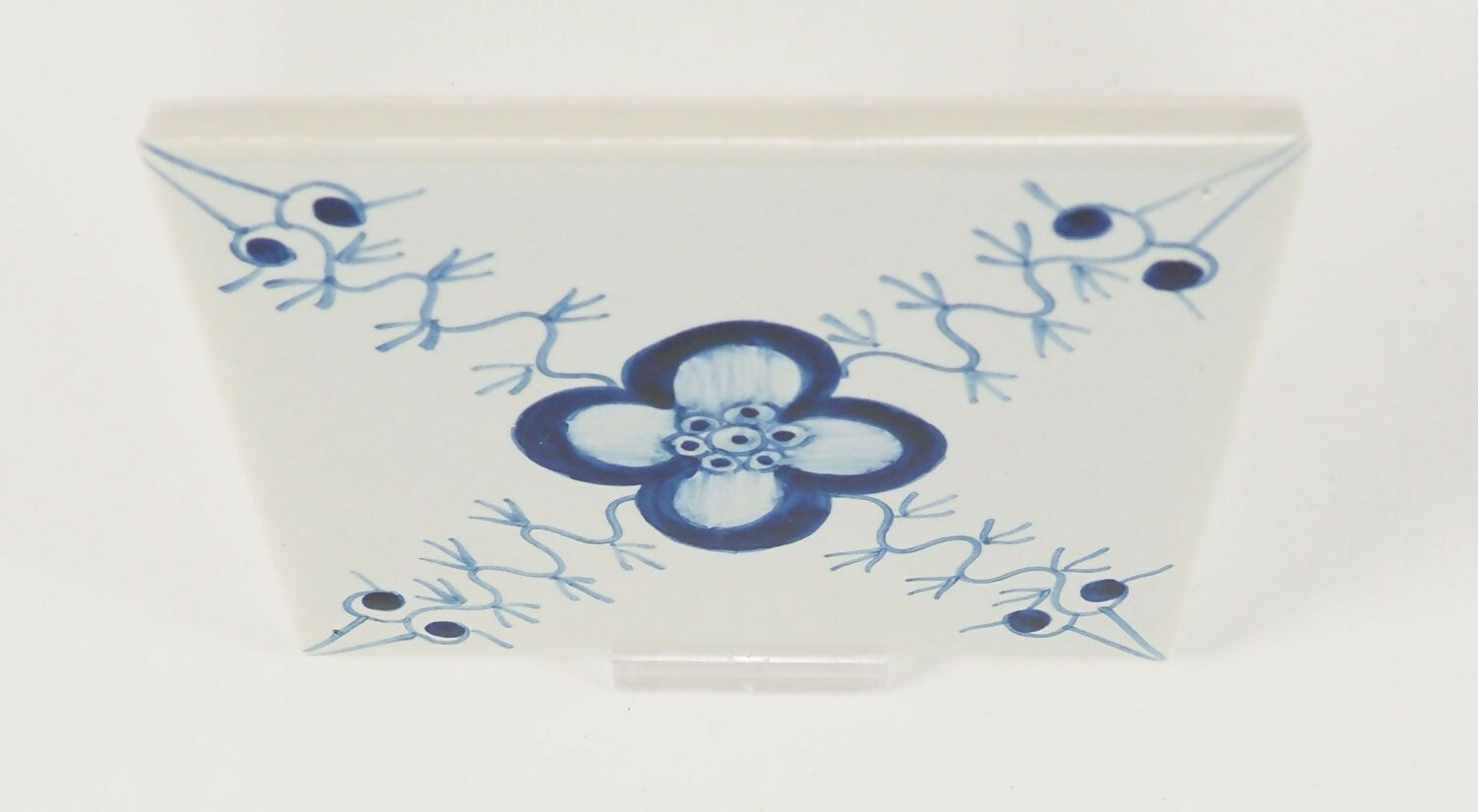Rectangular ceramic plate with blue floral design on a white background,  available  to buy on the-salon.com. SALON curates the finest , unique, handmade pieces from the interior industry's best makers and brands. Shop luxury furniture, lighting, rugs, art, antiques and vintage pieces and accessories from SALON interior designed rooms.