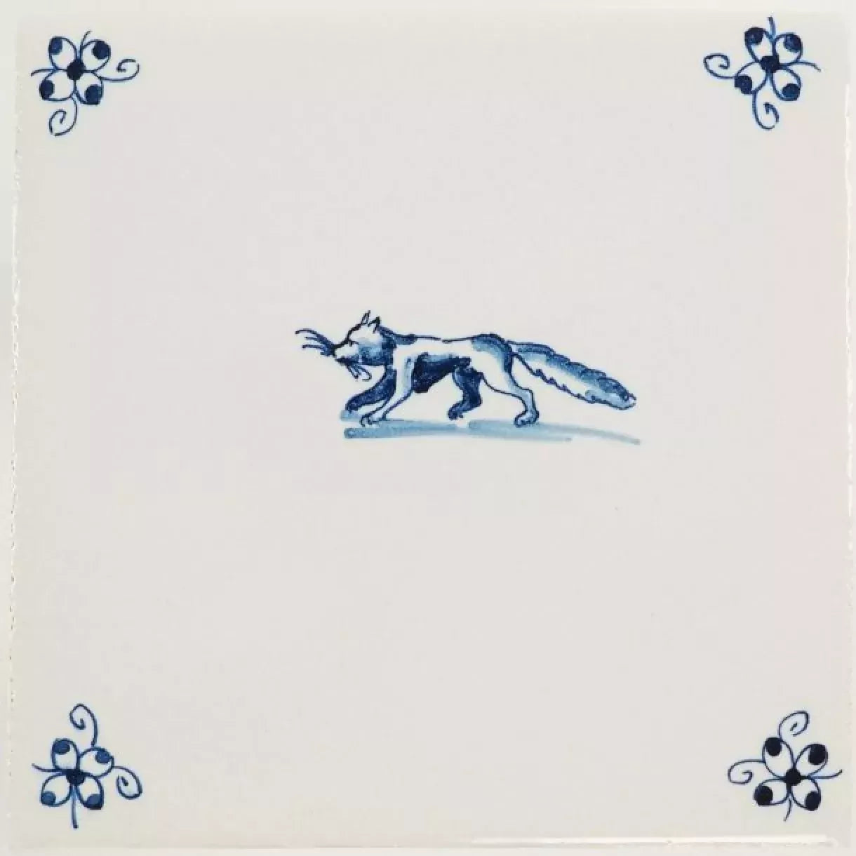 Decorative tile with a blue fox design on a white background,  available  to buy on the-salon.com. SALON curates the finest , unique, handmade pieces from the interior industry's best makers and brands. Shop luxury furniture, lighting, rugs, art, antiques and vintage pieces and accessories from SALON interior designed rooms.