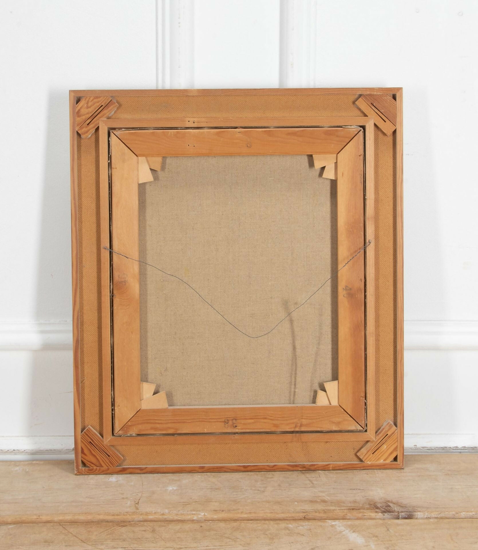 Wooden picture frame on a wooden floor with a white wall background,  available  to buy on the-salon.com. SALON curates the finest , unique, handmade pieces from the interior industry's best makers and brands. Shop luxury furniture, lighting, rugs, art, antiques and vintage pieces and accessories from SALON interior designed rooms.