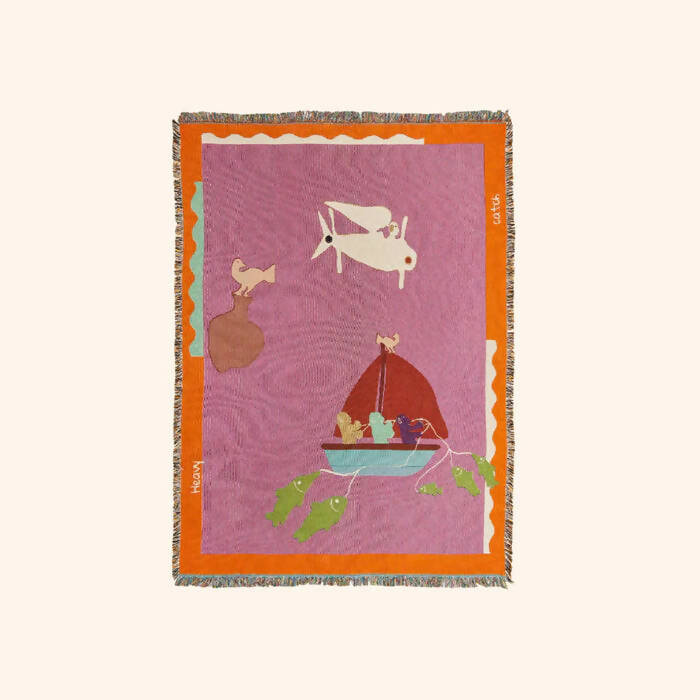 A multicolored throw blanket with a cultural motif, hung in front of a white background,  available  to buy on the-salon.com. SALON curates the finest , unique, handmade pieces from the interior industry's best makers and brands. Shop luxury furniture, lighting, rugs, art, antiques and vintage pieces and accessories from SALON interior designed rooms.