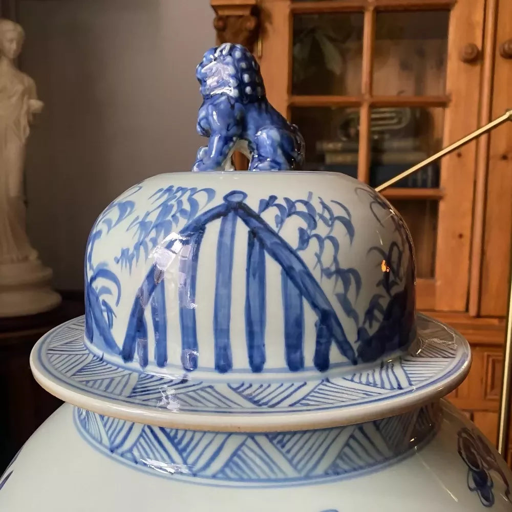 Blue and white decorative vase on a marble table with wooden cabinet in the background,available to buy from the-salon.com. SALON curates the finest unique handmade pieces from the interior industry's best makers and brands. Shop luxury furniture, lighting, rugs, art, antiques and vintage pieces and accessories from SALON interior designed rooms.